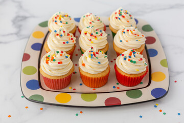 Vanilla Cupcakes with Buttercream Icing Decorated with Sprinkles