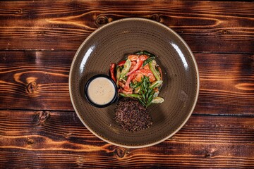 Delicious Peppercorn Steak with Vegetables and Sauce on Plate, Top View on Textured Restaurant Wood Table Background