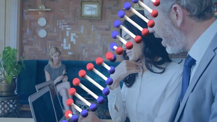 Woman typing on laptop, colleague using smartphone in lounge, showing health tech DNA helix overlay - Powered by Adobe