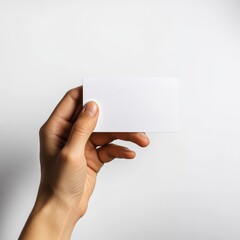 Fototapeta premium Blank White Business Card Mockup in Hand: Clean Minimalist Design for Branding and Marketing