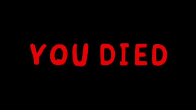 Animated red words “You Died” typed in a sloppy font, a horror videogame phrase isolated on a black screen background