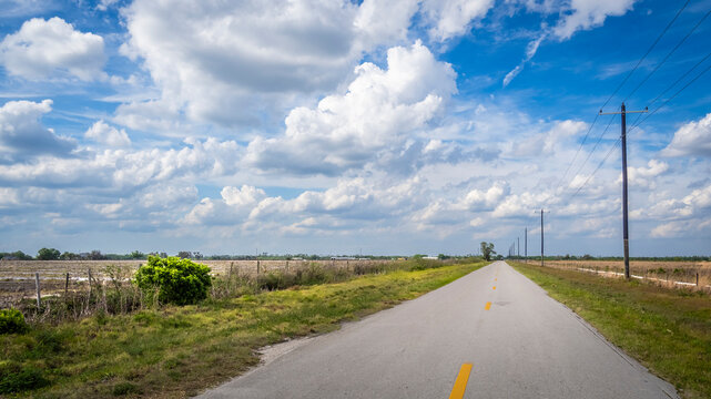 Long straioght flat road in interior of Florida USA