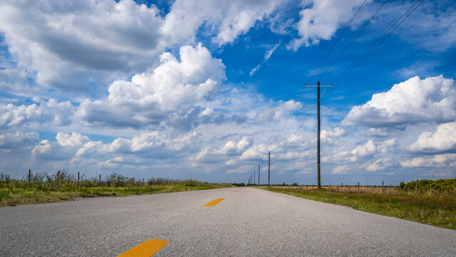 Long straioght flat road in interior of Florida USA