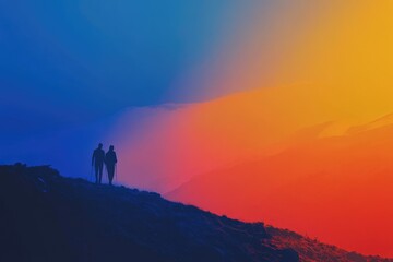 Silhouetted hikers ascend a mountain against a vibrant, colorful sunset.