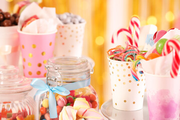 Candy bar. Many different sweets in festive decorated room, closeup