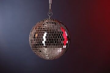 One shiny disco ball on dark background