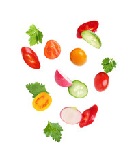 Different cut fresh vegetables falling on white background