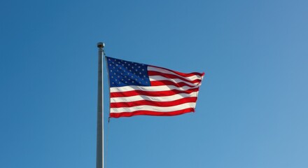 American Flag Waving in Blue Sky - Photo