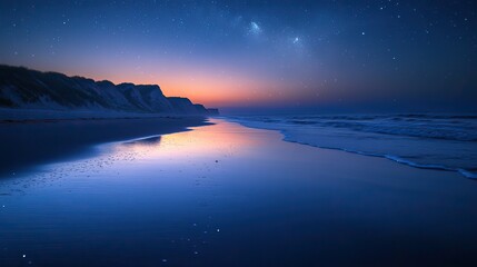 Fototapeta premium A quiet beach at twilight with the first stars beginning to appear in the sky