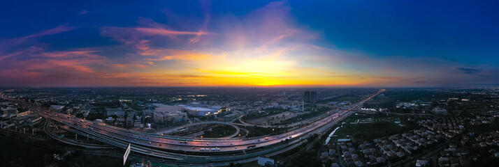 Aerial top view of transportation with Expressway, Road and Roundabout, multilevel junction traffic highway-Top view. Important infrastructure and transport in big city, Bangkok Thailand.