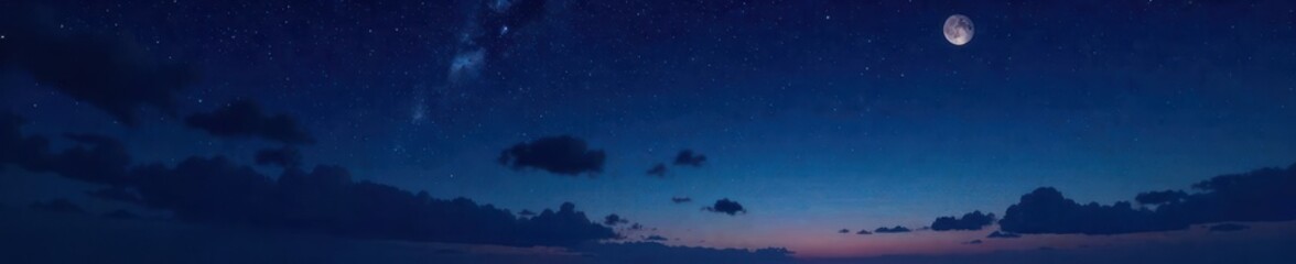 Dark starry night sky with a few scattered clouds and a crescent moon in the top left corner, night, universe