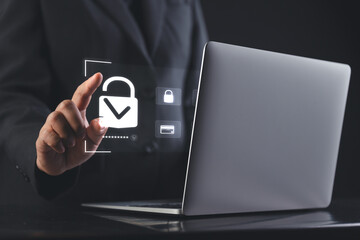 cybersecurity themed illustration showing biometric lock icons on virtual interface representing corporate data protection by a professional hand gesture in a secure workspace