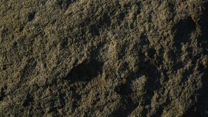 Close-up textured dark earth, natural material, outdoor background