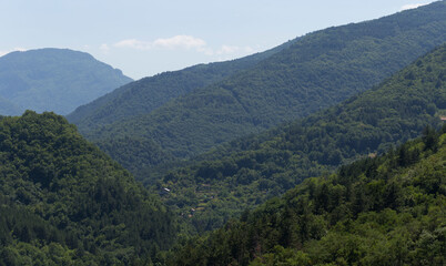 Fototapeta premium Rhodopes, are a mountain range in Southeastern Europe. Bulgaria. Panorama. The forest area covers the mountains.