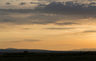 Sunset over the Balkans. The stillness and the dusk. Cirrus clouds in a crimson sky.