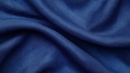 A close-up image of textured blue fabric, showcasing intricate weaving patterns and a rich color depth.
