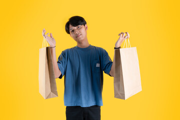 a man holding two of brown shopping bags
