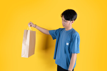 a man with brown shopping bag looked to his bag