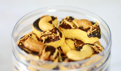 Chocolate cashew cookies on white background. 