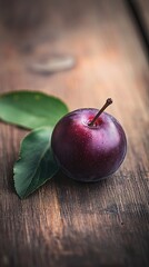 plum isolated on wooden background