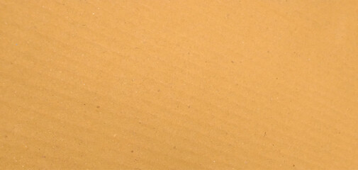 Cardboard sheet texture background, pattern of brown kraft paper with vintage style. It is a background material of a light yellow craft board.