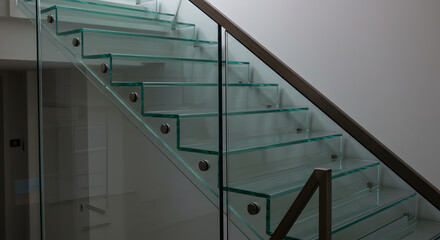 Contemporary Glass Staircase With Metal Railing in Modern Interior Design