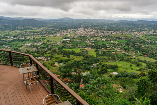 View from the restaurant to a wide valley in the mountains. View of the city of Jarabacoa in the Dominican Republic.