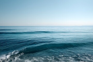 Fototapeta premium Serene Seascape Calm Blue Ocean with Gentle Waves and Distant Coastal Horizon