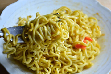 Delicious instant noodles on a plate