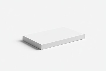 Naklejka premium A rectangular, blank white cardboard box, presented on a plain surface.
