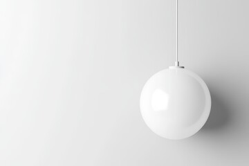 Simple, minimalist, white, spherical pendant light fixture.