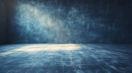 empty blue room with textured wall and wooden floor in moody lighting