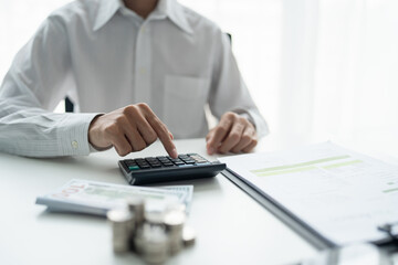 Businessman checking bills taxes bank account balance and calculating annual financial statements of company. Accounting Audit Concept