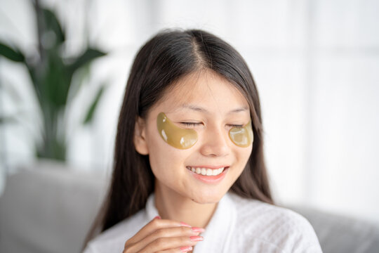 Daily beauty routine Asian woman  self care and relax with silicone under eye patches  smiling happy using skincare product