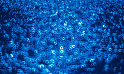 Bokeh of binary code on blue background. Abstract technology concept.