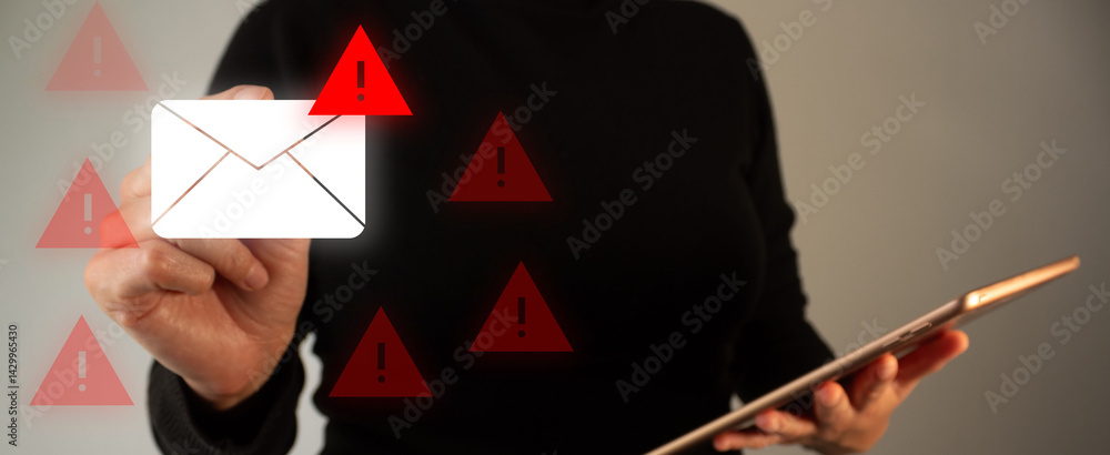 Poster concept of spam email. person's hand holding a digital tablet while pointing at an email icon with a