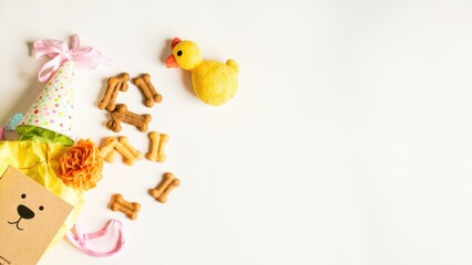 Dog birthday flat lay with treats and party hat