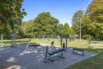 Outdoor fitness park with exercise equipment