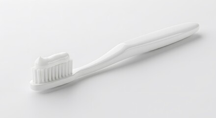 Isolated on white, a white plastic toothbrush with white toothpaste exemplifies dental hygiene for clean, healthy teeth and oral care