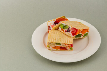 Delicious jelly waffle cakes with fresh fruits and cream