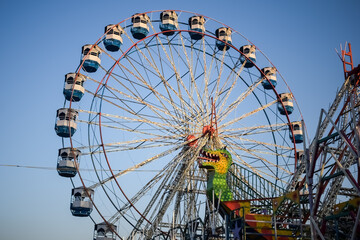Closeup of multi-coloured Giant Wheel during Dussehra Mela in Delhi, India. Bottom view of Giant...