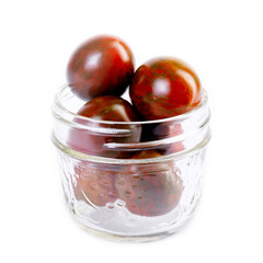 Isolated Jar with cherry tomatoes of unique color: red with dark green overlay (striping)for a 