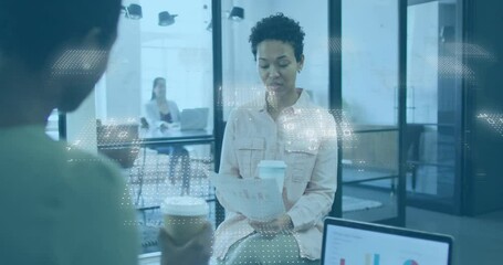Woman holding coffee cup while speaking in technology office with floating binary code overlay - Powered by Adobe