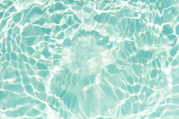 Blue water with ripples on the surface. Defocus blurred transparent blue colored clear calm water...