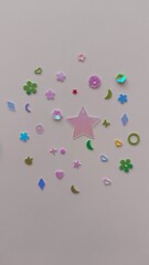 Scattered multi-colored seqines isolated on white background