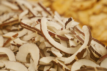Coconut slices arranged on a vibrant market display in summer