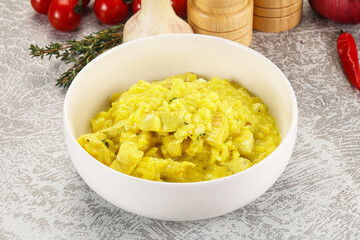 Italian cuisine - yellow risotto with chicken