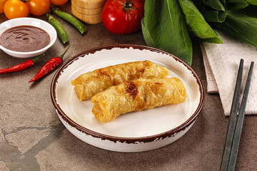 Vietnamese stuffed spring roll served sauce