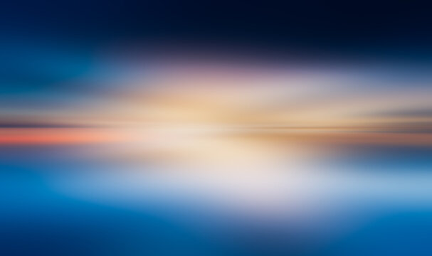 Abstract blurred landscape with a gradient sky and horizon . sunset colors on ocean horizon, motion blur .Sunset blur nature summer background cloud gradient overlay dramatic weather orange sky