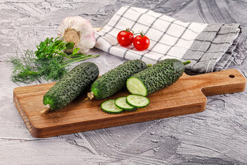 Raw green cucumbers with slices